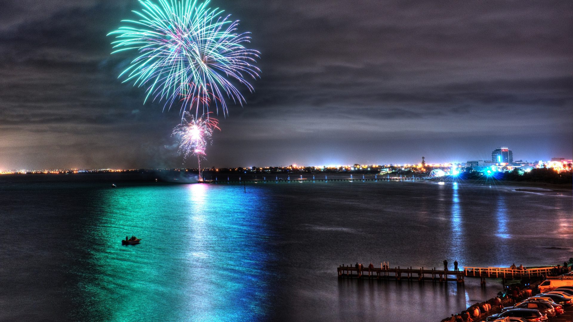 Fireworks over a harbor waterfront skyline — Port Alden Harbor Festival